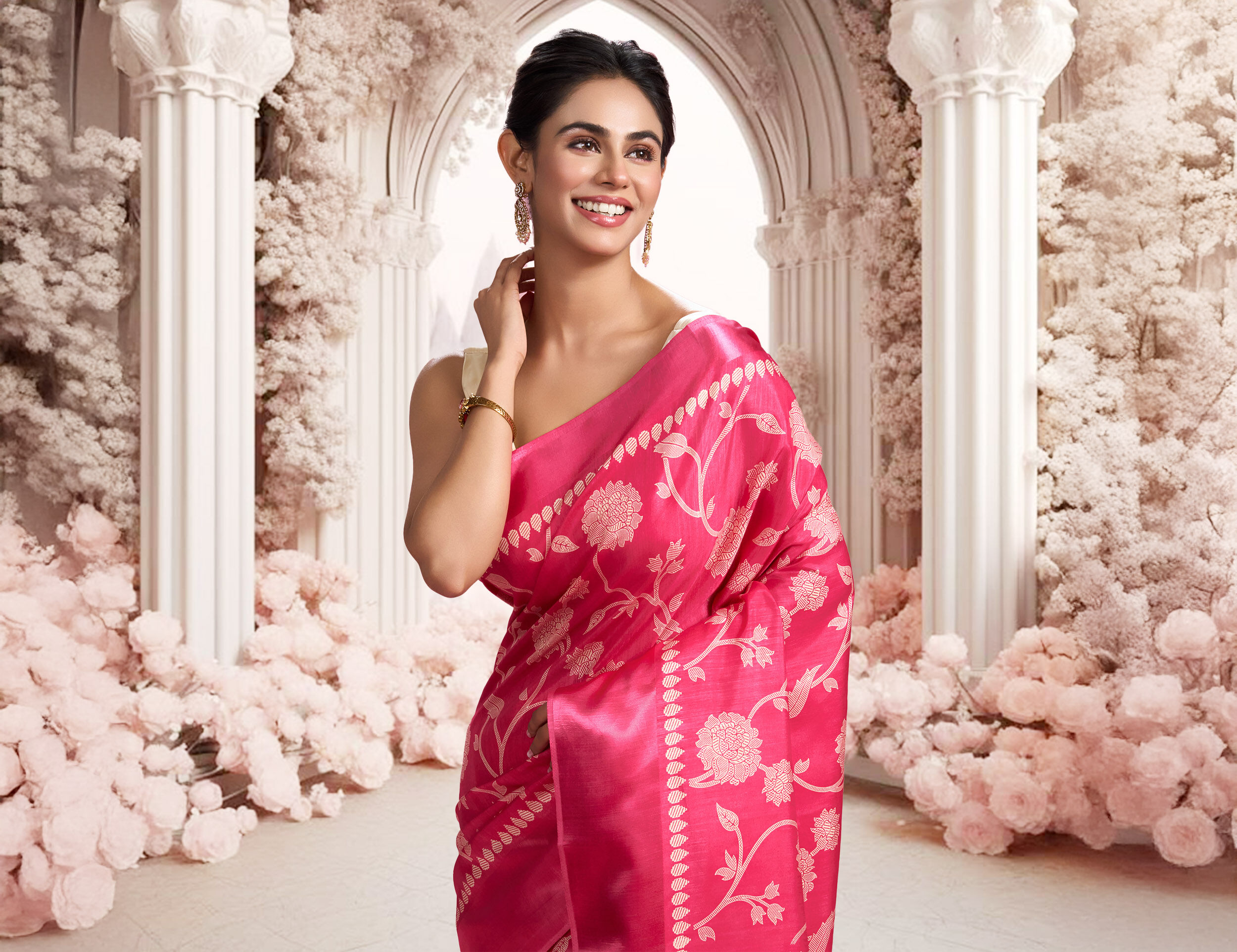 Women flaunting her elegant pink Saree with metallic silver motifs